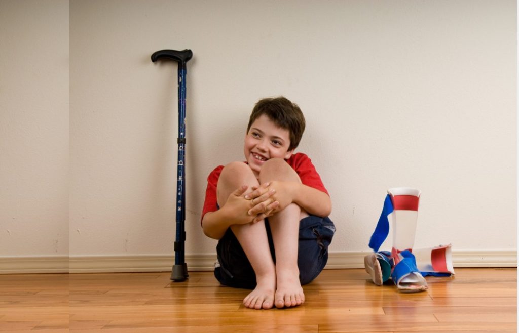 Boy with AFOs (Ankle foot orthoses or leg braces)